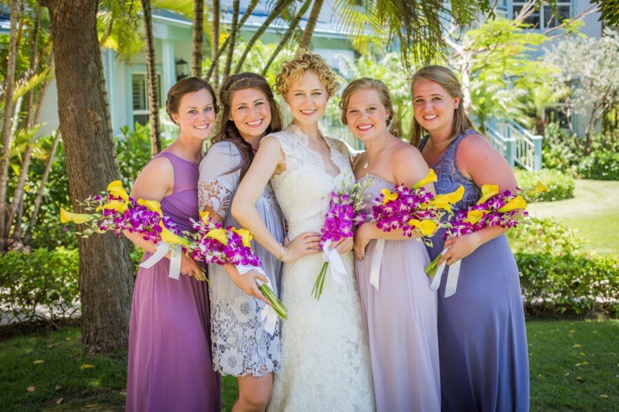 Kayla’s vision for mismatched bridesmaids dresses, in various shades of purple and unique styles, gave the girls a relaxed look that captured each of their personalities beautifully.