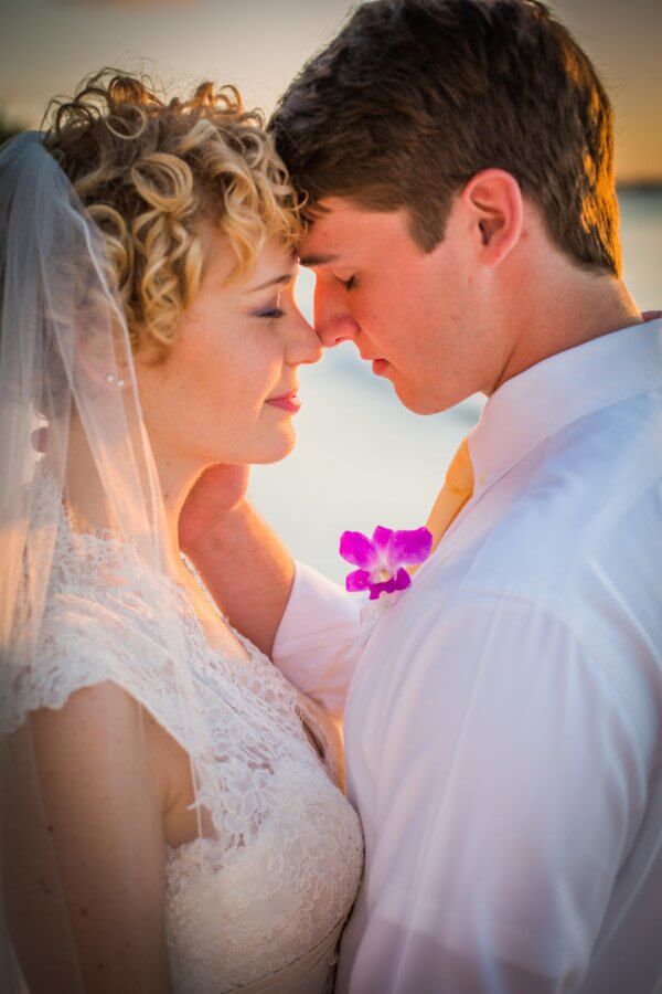 The newlyweds returned to the beach at sunset for some photos during the magic hour. They are a dream!