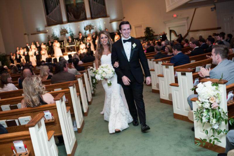  Lauren and John walking hand in hand for the first time as man and wife.
