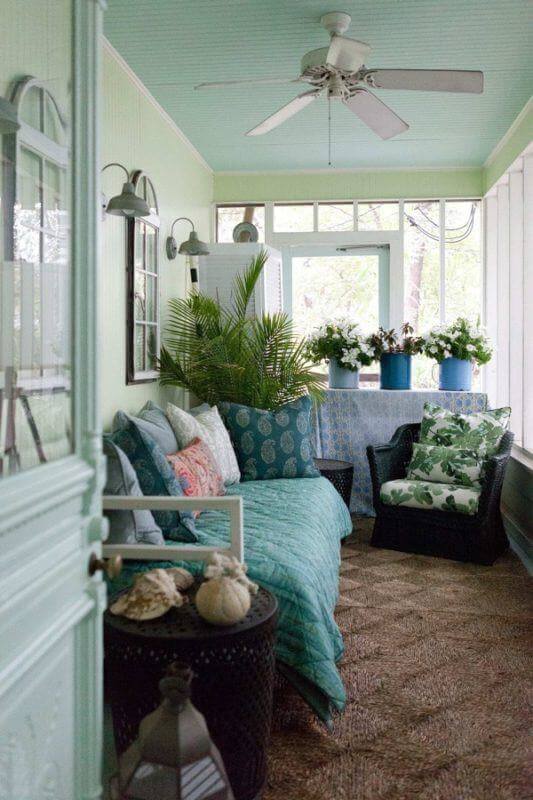 Meredith put a daybed on the screened porch for snoozing or reading. The skirted table at the end of the room can be used as a bar for entertaining, or just houseplants and flowers for day-to-day life. Meredith put a daybed on the screened porch for snoozing or reading. The skirted table at the end of the room can be used as a bar for entertaining, or just houseplants and flowers for day-to-day life.