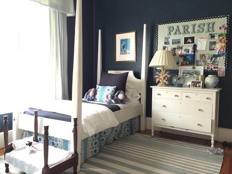 “I didn’t want a traditional pink girls room for my daughter,” says the designer. “I love pink, but I felt like it needed to be a bit more sophisticated, especially since her room ends up being used as a playroom for our little boy as well.” Paneled walls were painted a deep dark navy blue, then offset with lots of bright white, and seafoam blue. To soften the room, Meredith added a floral bed skirt out of Rocat by Tilton Fenwick for Duralee (duralee.com) and indoor/outdoor rug from Dash & Albert (dashandalbert.com). “I didn’t want a traditional pink girls room for my daughter,” says the designer. “I love pink, but I felt like it needed to be a bit more sophisticated, especially since her room ends up being used as a playroom for our little boy as well.” Paneled walls were painted a deep dark navy blue, then offset with lots of bright white, and seafoam blue. To soften the room, Meredith added a floral bed skirt out of Rocat by Tilton Fenwick for Duralee (duralee.com) and indoor/outdoor rug from Dash & Albert (dashandalbert.com).