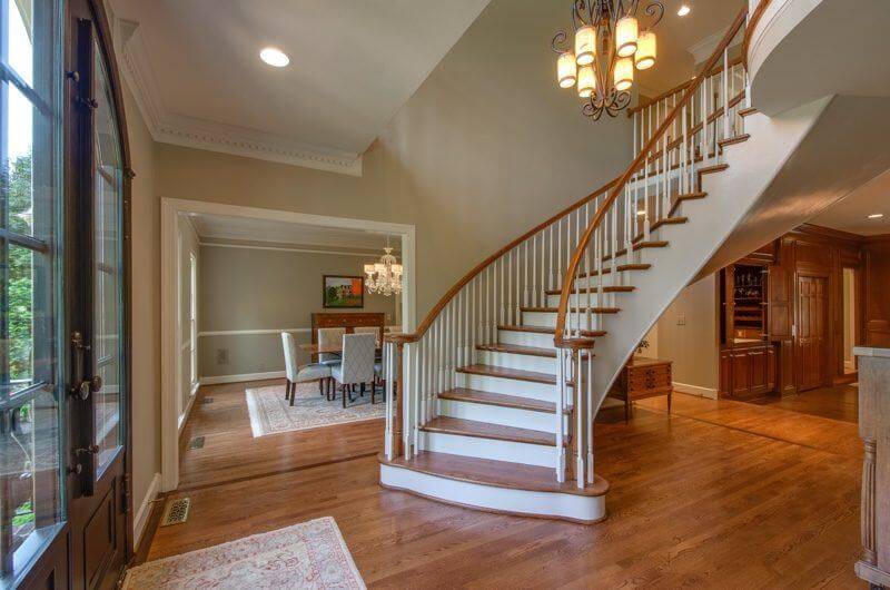 This custom, elliptical staircase is stunning and a beautiful sight to see upon first entering the home.