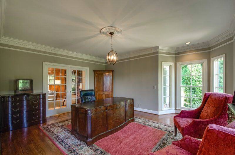 A stately office, located off to the right of the foyer, has ample natural light to inspire any workday.