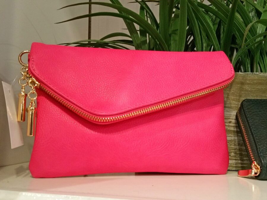 We love this hot pink clutch with asymmetrical zipper fold from Ellie! We love this hot pink clutch with asymmetrical zipper fold from Ellie!