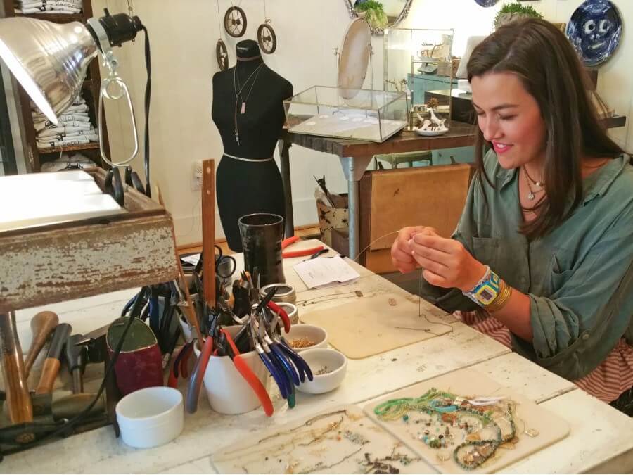 Perch employee Katie-Gray works on a necklace. Perch employee Katie-Gray works on a necklace.