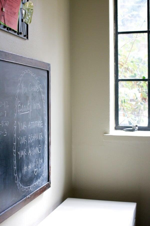 The chalkboard, situated above the family's "mudroom" cabinets for backpacks and shoes, features the family menu, to-do notes and motivational sayings from mom!