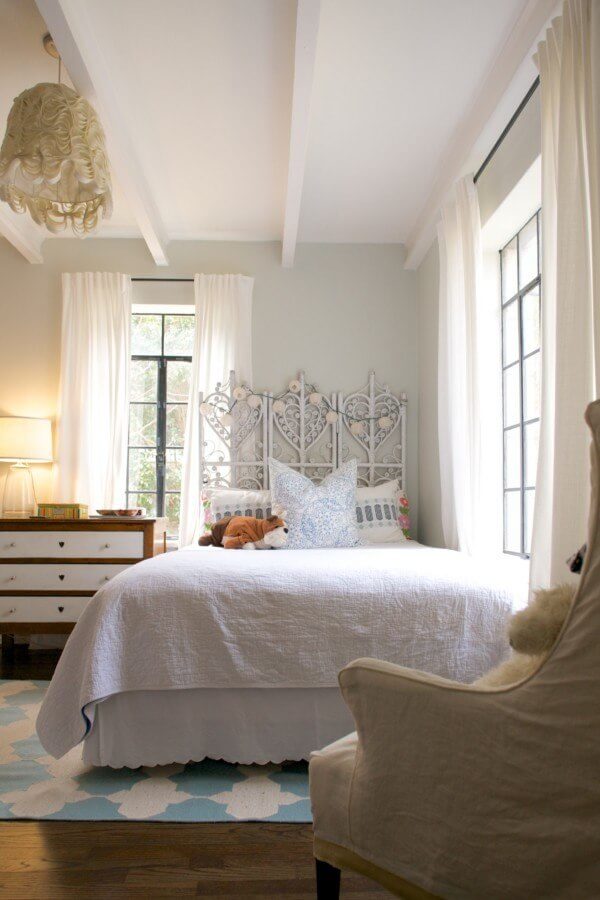 Caroline's daughter's room features soft feminine touches in shades of blue and white.