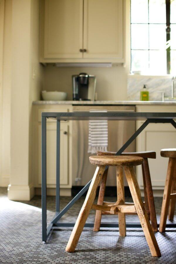 A mix of rustic stools adds old world charm.