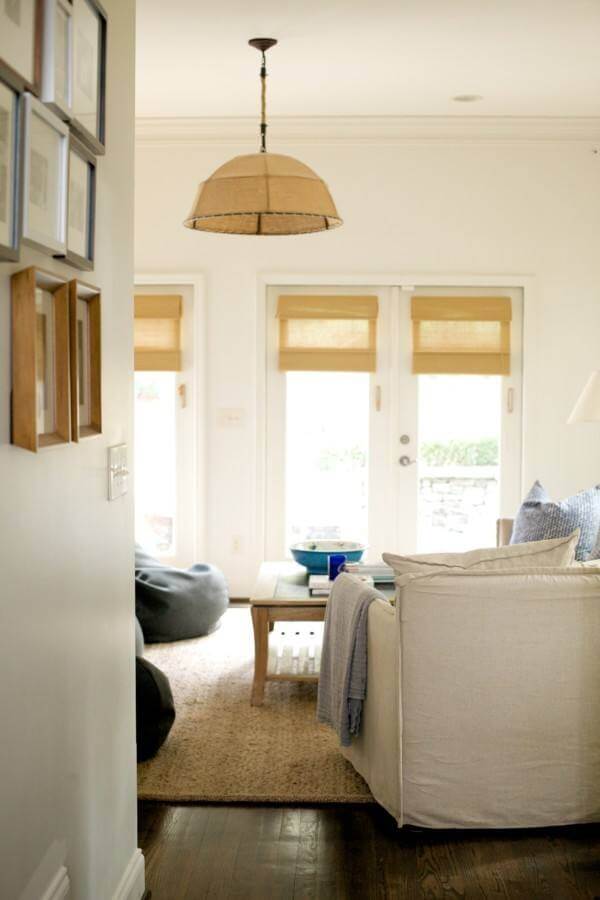 This striking linen burlap light fixture from Restoration Hardware seems to anchor and set the relaxed tone of the room. 