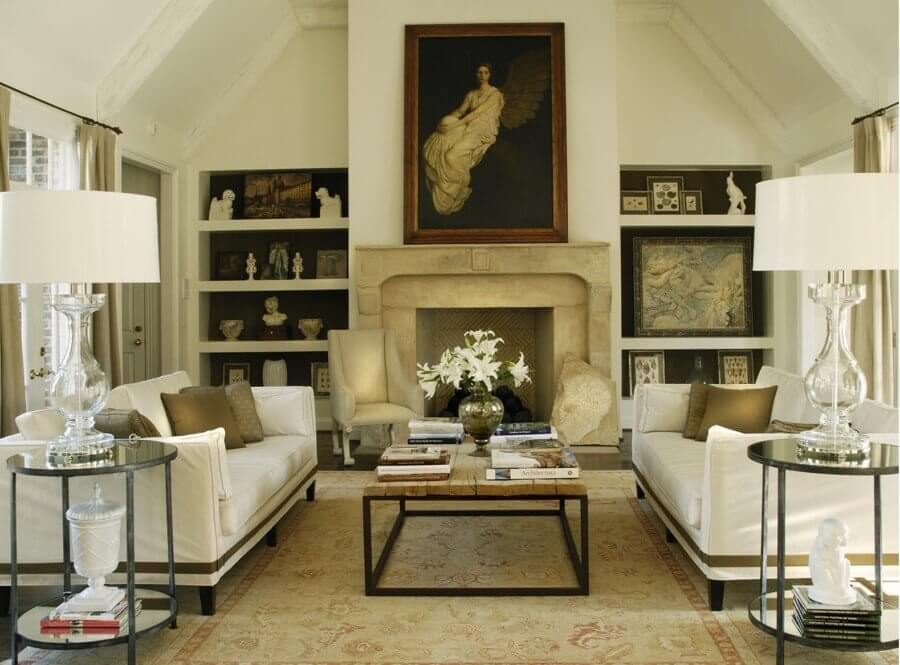 Muted neutral tones mix with classic white for a modern take on this traditional living room. Image: Howard Lee Puckett Photography