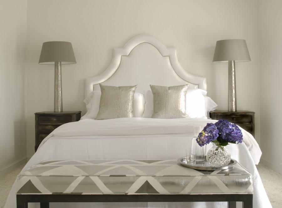 Metallic silver adds more light-reflecting surfaces to this all-white room, allowing the room to be filled with light during the day. Image: Howard Lee Puckett Photography
