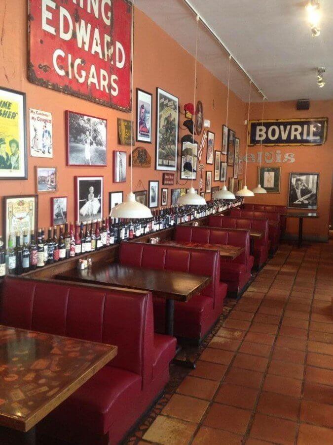 The collage of art on the walls of DePalma's is as special and interesting as the menu itself.