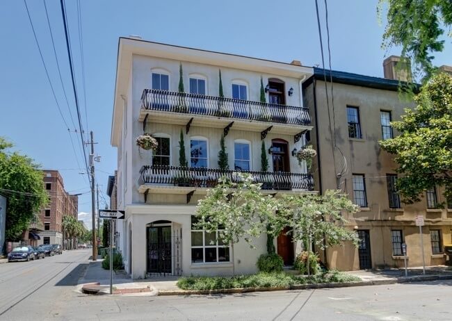 The 1886-built Savannah house has its original iron balconies, giving the façade a New Orleans flair.