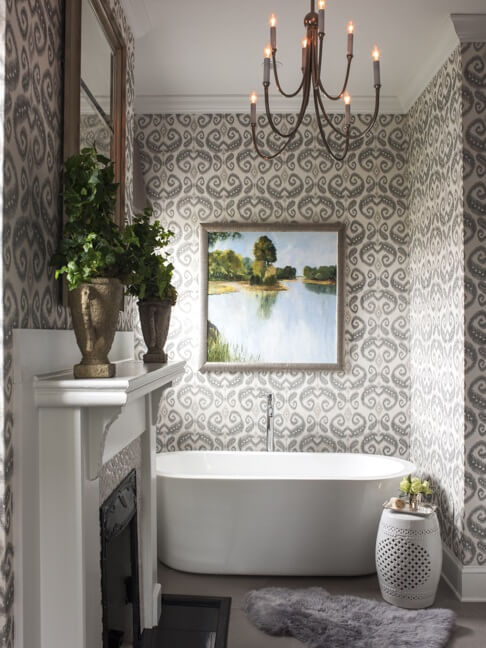 Wallpaper by Phillip Jeffries (phillipjeffries.com) covers the walls in this gracious master bath.