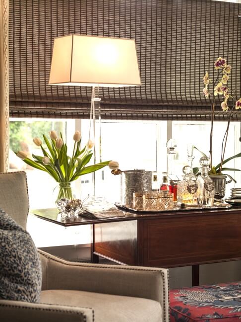 “The bar in this room is from the 1800s,” says Brandon. “It has a silver tray built in, and when you close the sides the tray goes down into the cabinet to hide the liquor.”