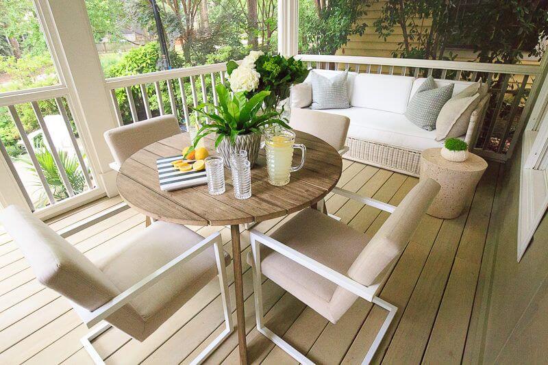 This is a case, says Selena, where less is more; items were chosen for their flexibility and multi-functionality. "We consolidated her porch to having a sofa with a little side table and a table with four chairs; the expands, offering multiple seating options." Image| Micki Martin