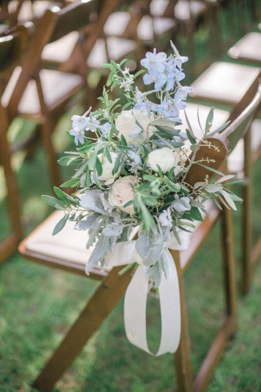 Sarah chose a soft spring palette of greens, soft pinks, pale blues and cream. She selected peonies, garden roses, gardenias and tulips along with lots of greenery, such as eucalyptus and dusty miller, that would complement the natural scenery well. Garden District took Sarah’s recommendations and create arrangements that blew her away!