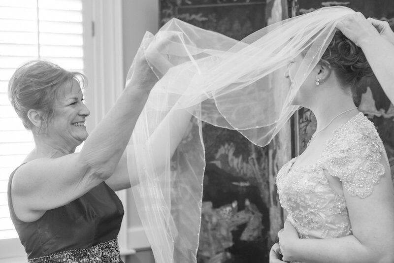 Sarah’s mom joyfully lowers her veil