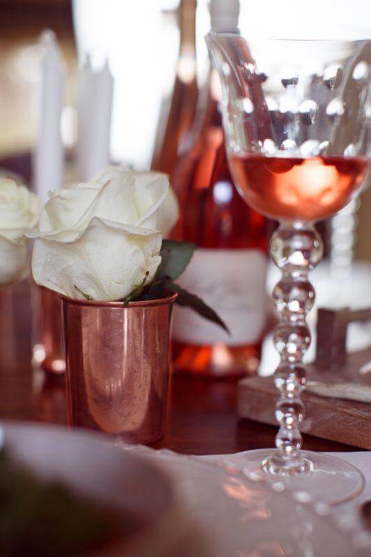 Roses in full-bloom are a nod to the featured drink.