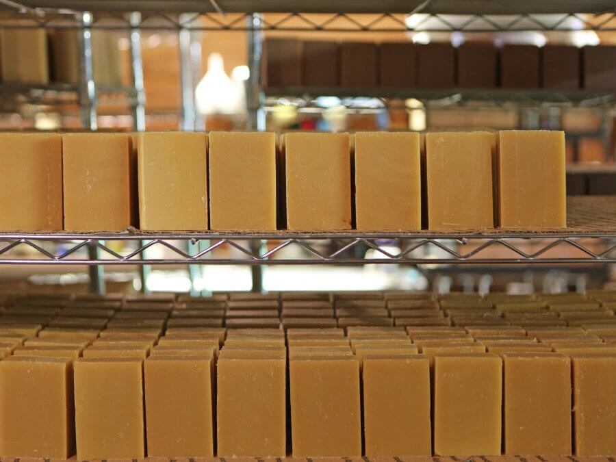 Here, the soap sits on shelves to dry for approximately a month before being packaged for sale.