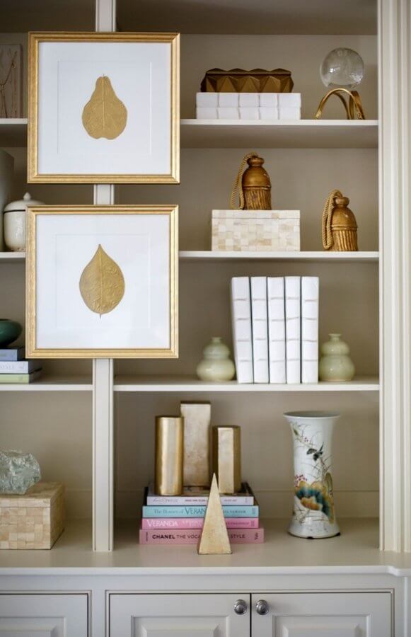“For accessories in the bookcase, it was really more about layering in subtle sheen and different finishes--some parchment, some hand-painted porcelain, some gold leaf--to act as a backdrop to the other elements in the room,” says Rachel. “For accessories in the bookcase, it was really more about layering in subtle sheen and different finishes--some parchment, some hand-painted porcelain, some gold leaf--to act as a backdrop to the other elements in the room,” says Rachel.