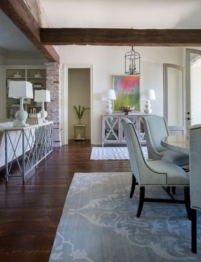 A soft gray rug from Jaipur Living (jaipurliving.com) lines the dining room. A vestibule beyond the dining area includes doors to the back yard. A soft gray rug from Jaipur Living (jaipurliving.com) lines the dining room. A vestibule beyond the dining area includes doors to the back yard.