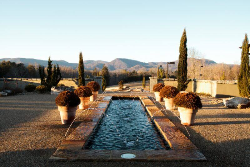 Enjoy a mountain sunset and a glass of wine in this lush hotel just outside of Greenville.