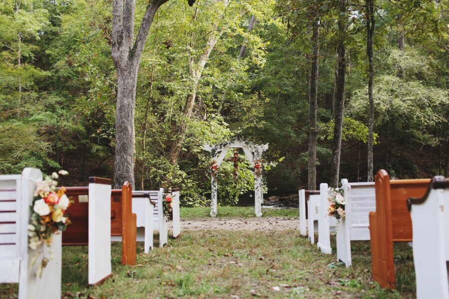 “The crisp air that day was perfect and we knew rain was heading our way. We chose to still have the outdoor ceremony, which the rain held off for, and I’m so glad we did,” Ivy says. “The wind stirring during our ceremony and the cool air from the storm created a really magical moment for us to get married in.” “The crisp air that day was perfect and we knew rain was heading our way. We chose to still have the outdoor ceremony, which the rain held off for, and I’m so glad we did,” Ivy says. “The wind stirring during our ceremony and the cool air from the storm created a really magical moment for us to get married in.”