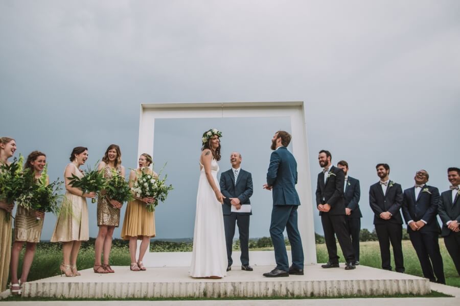 Mandy puts the ring on the wrong finger after an earlier gaffe, prompting guffaws from the wedding party, the officiant and the audience. 