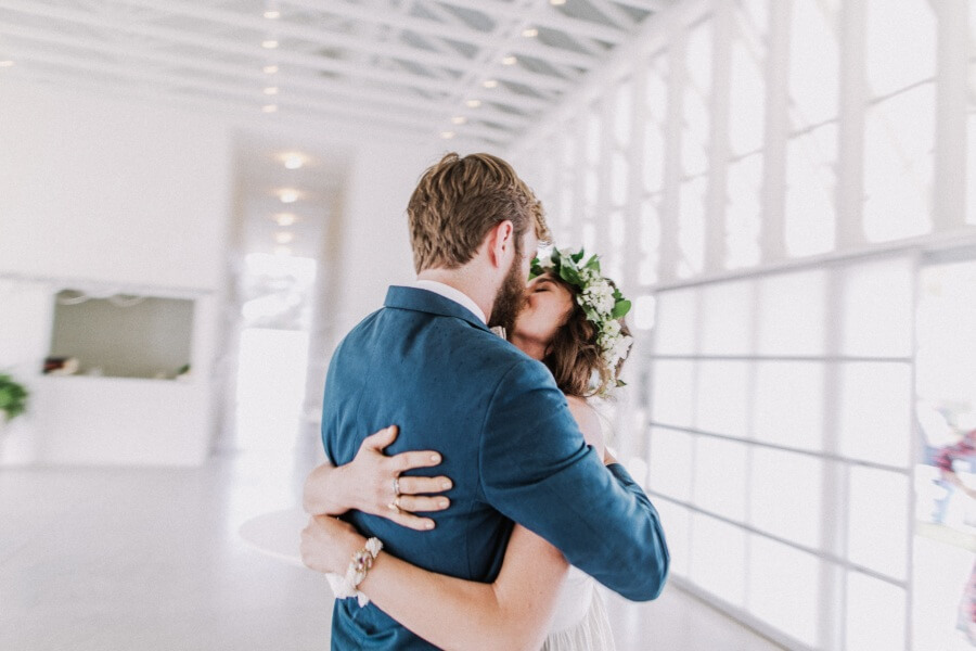 The newlyweds embrace before the reception begins.