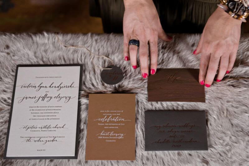 Ivy Robinson works on invites for an event.