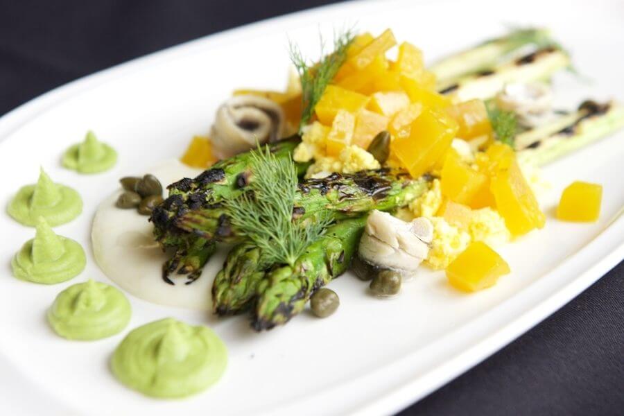 The etc. spin on asparagus salad — with diced yellow beet, shaved egg, dabs of Deb's famous pea pesto, white anchovy rollups and clusters of capers. 