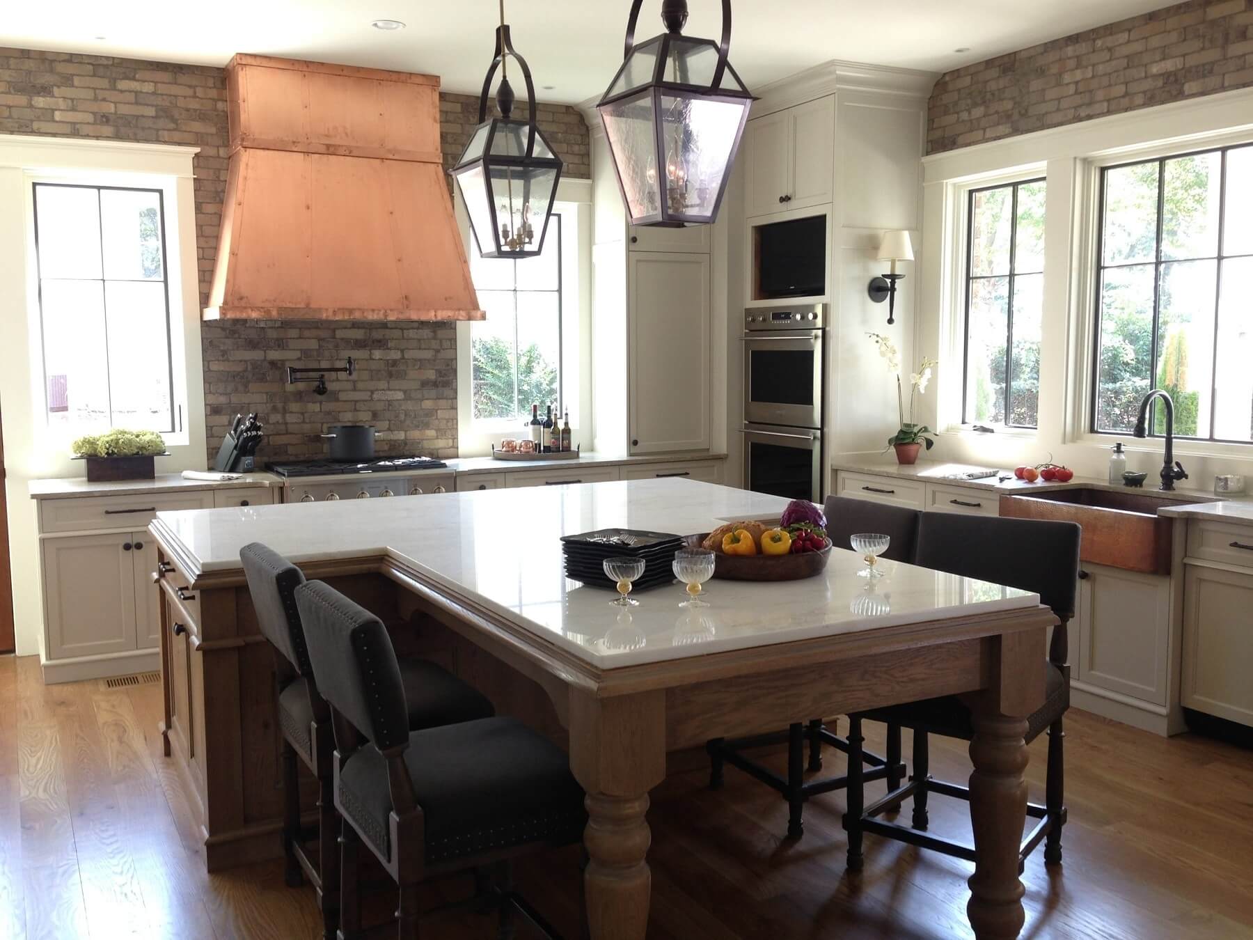 Copper, brick and old-fashioned lantern lights intermingle with modern elements for a timeless look. Image: T. Scott Carlisle of Christopher Architecture and Interiors
