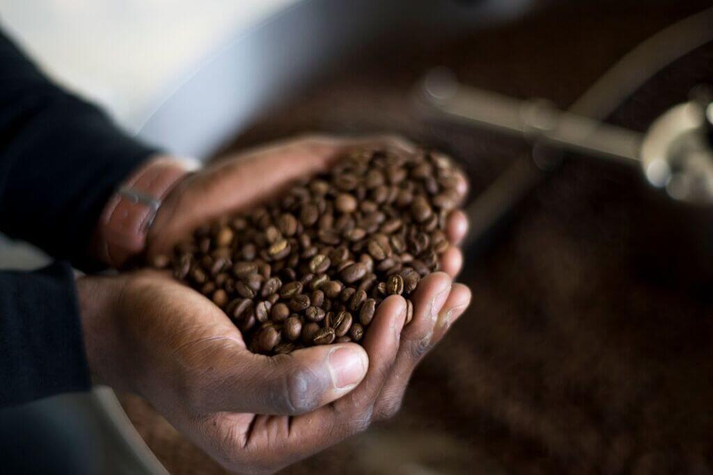 We can almost smell this aromatic handful of freshly roasted coffee beans.