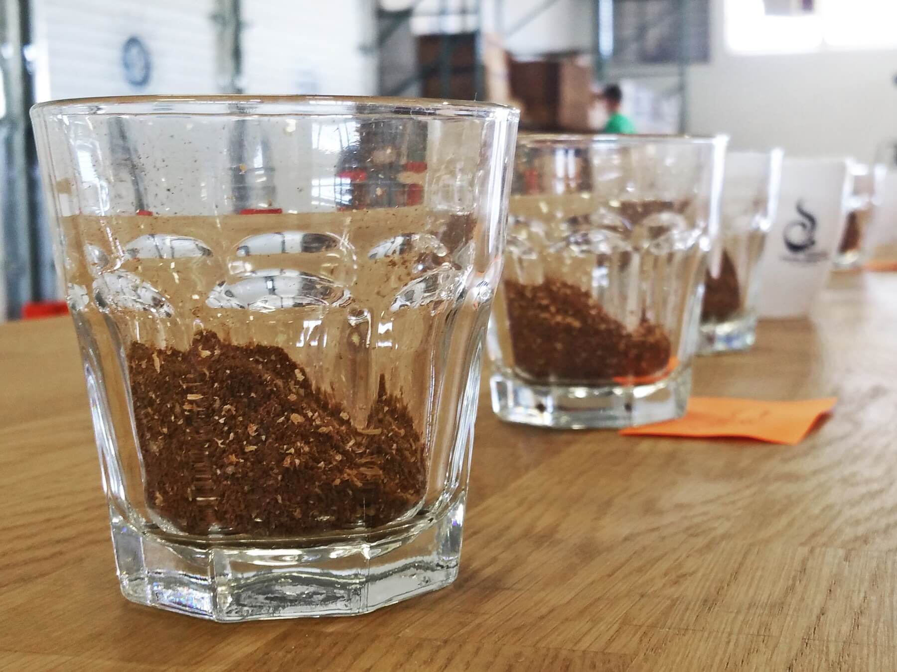 The first step of the cupping process is to gently shake and sniff the dry fragrance of the ground beans.
