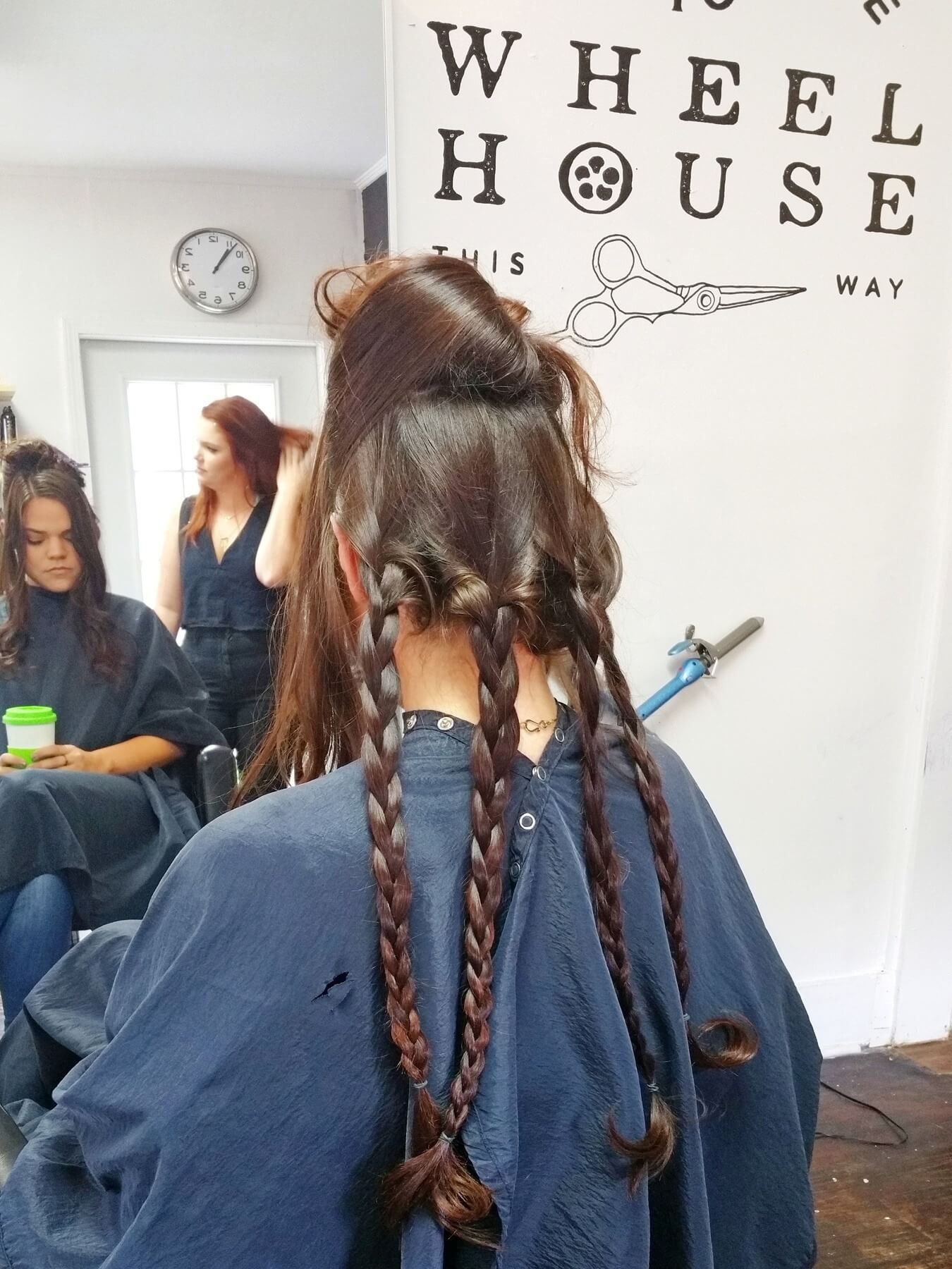 Section off bottom part of hair. Braid into four sections. Section off bottom part of hair. Braid into four sections.