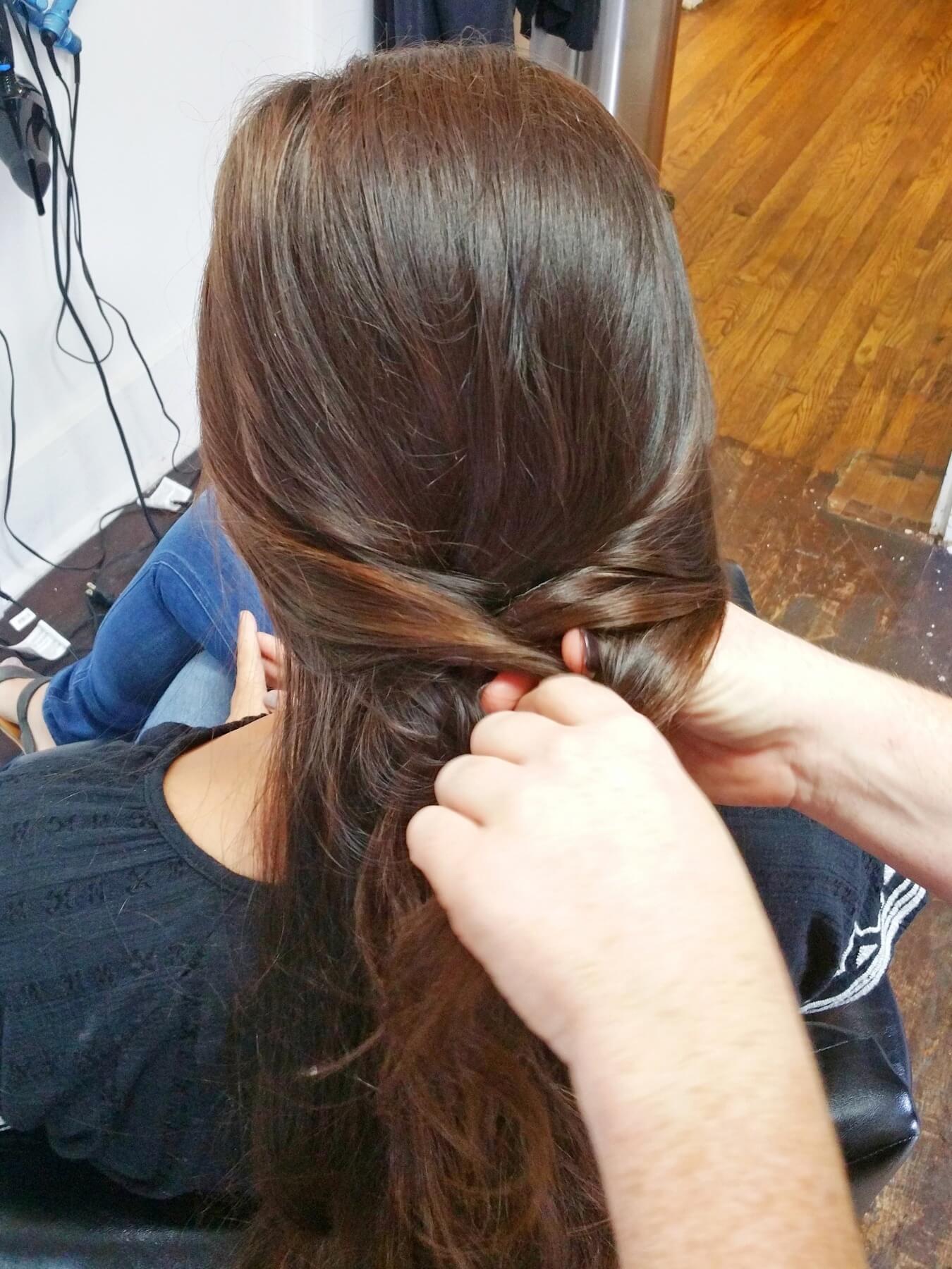 Loop front pieces into braid. Loop front pieces into braid.