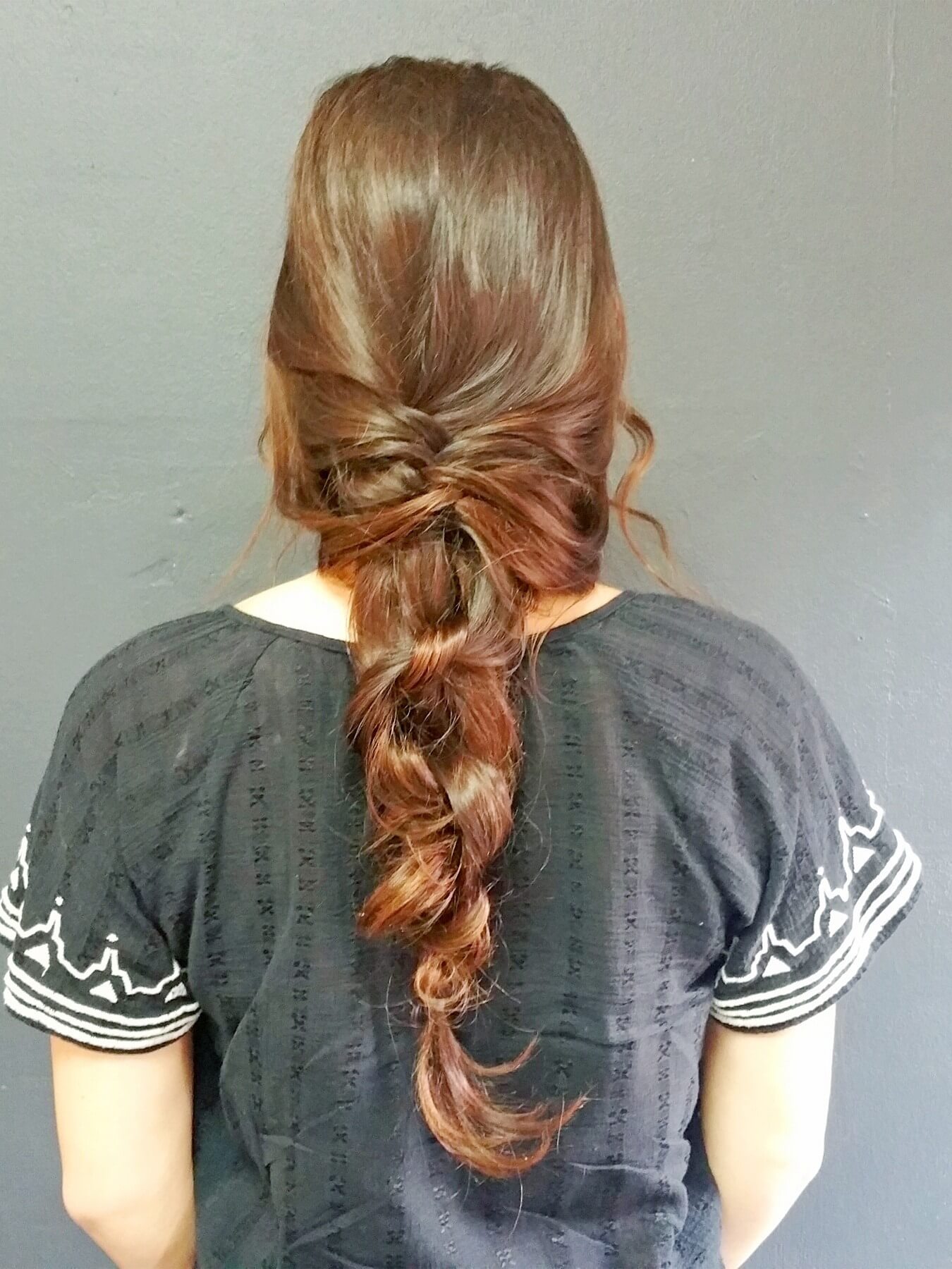 This loose, lovely ropey tail includes a fishtail braid and plain ole knots for an elegant, classical look. This loose, lovely ropey tail includes a fishtail braid and plain ole knots for an elegant, classical look.