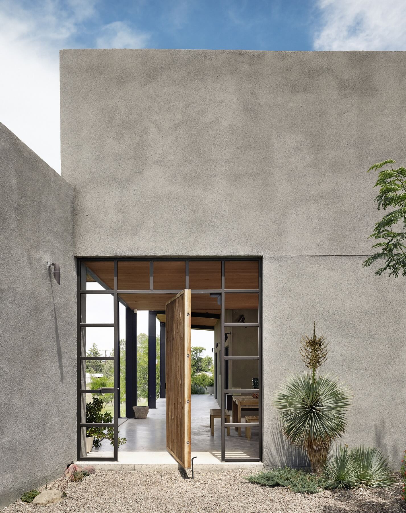 "This 2,300-square-foot house seems inscrutable from the street, and a passerby would never guess that the two wings, which open eighty degrees to take in the north view, are as much glass as wall," says Helen. "This 2,300-square-foot house seems inscrutable from the street, and a passerby would never guess that the two wings, which open eighty degrees to take in the north view, are as much glass as wall," says Helen.