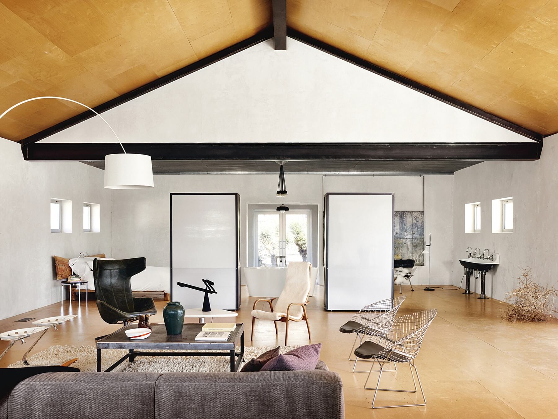 Homeowner and designer Barbara Hill used birch plywood on the ceiling and the floor for visual continuity. Homeowner and designer Barbara Hill used birch plywood on the ceiling and the floor for visual continuity.
