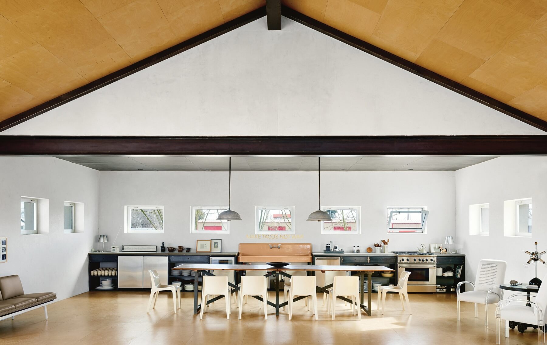 The entire kitchen stretches across one wall for a striking visual. the open space is perfect for hosting parties. The entire kitchen stretches across one wall for a striking visual. the open space is perfect for hosting parties.