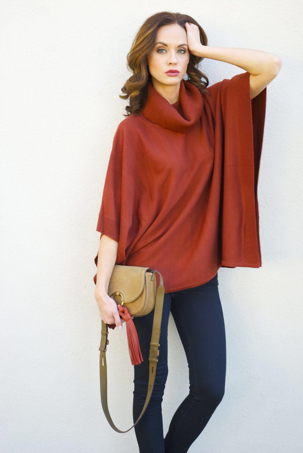 From Gus Mayer: Metric poncho; DL1961 jeans and Tory Burch bag