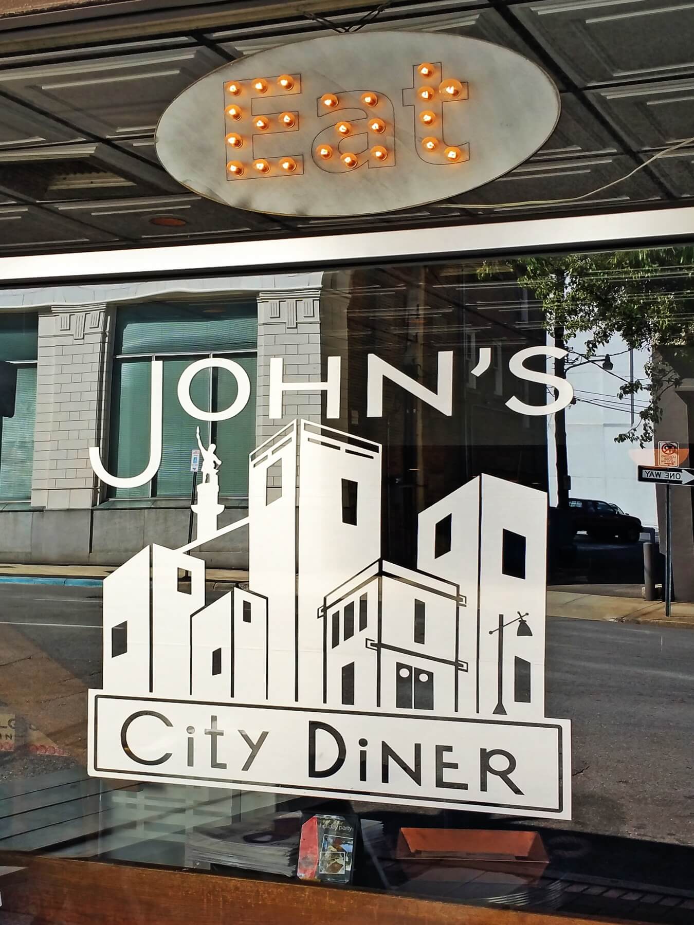 John's City Diner's sharp logo greets customers as they approach the downtown eatery. John's City Diner's sharp logo greets customers as they approach the downtown eatery.