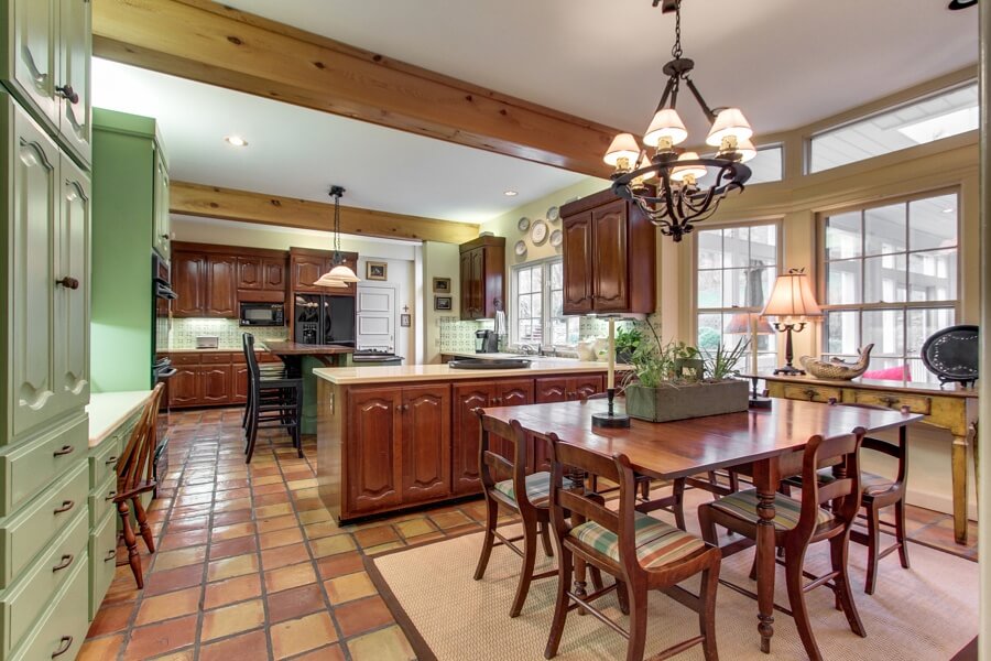 This spacious kitchen offers plenty of storage, lots of natural light and ample seating for families large and small. This spacious kitchen offers plenty of storage, lots of natural light and ample seating for families large and small.