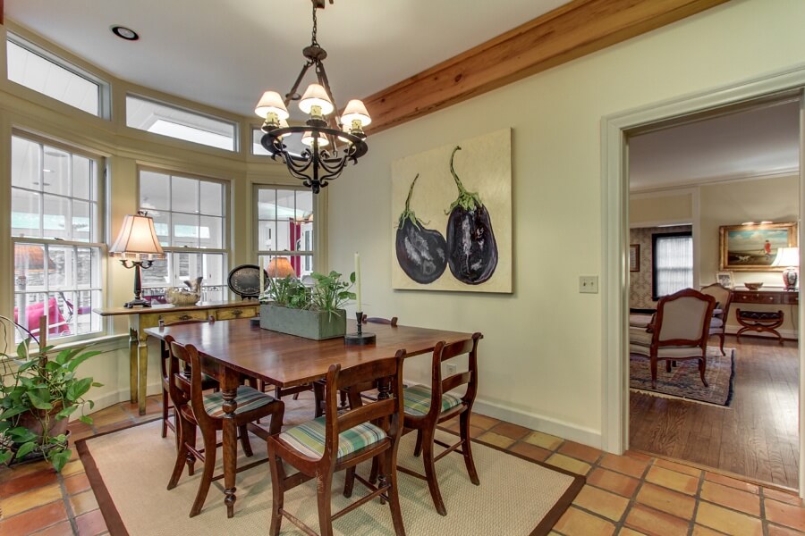The eat-in area features tile flooring, transom windows and moldings. The eat-in area features tile flooring, transom windows and moldings.