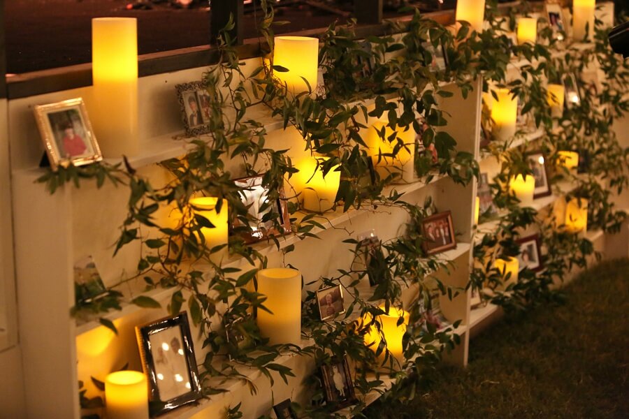 Another great idea! Libby and Dana used bookcases with greenery to display the family photos.
