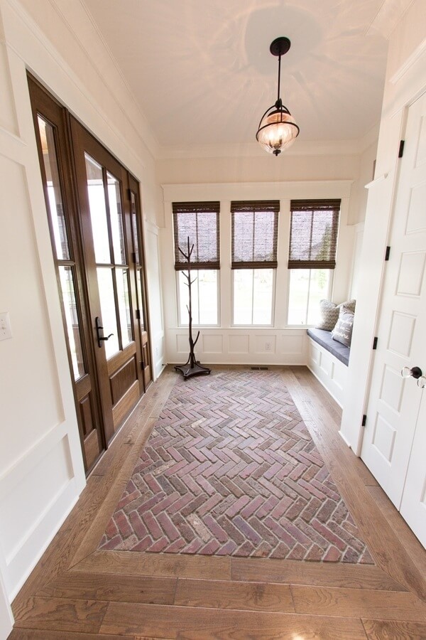Wood and brick have never been done in so many decorative ways. Wooden door, bead and batten paneling and inlaid brick herringbone makes this a delight of textures.