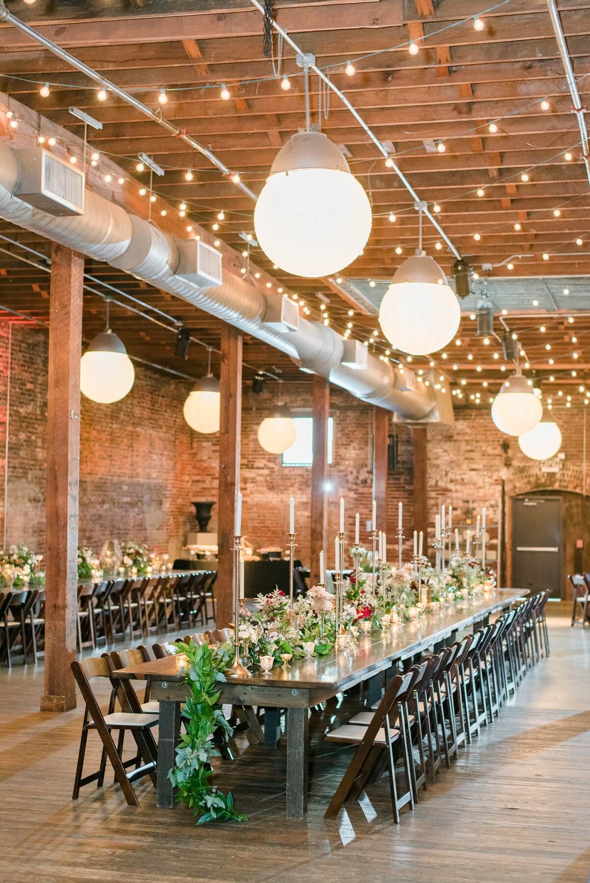 “I wanted rich, delicate greenery everywhere. Jessica at HotHouse Design Studio went above and beyond for me and found this beautiful, dainty greenery indigenous to my home state, Tennessee," says Brittni. "It really dressed up the dark exposed brick and beams and gave that luxe bohemian feel I was wanting."
