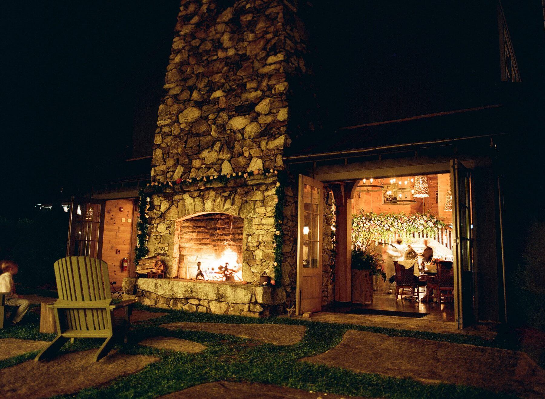 A little fella takes audience with this crackling outdoor fireplace as the adults savor their dinner inside. A little fella takes audience with this crackling outdoor fireplace as the adults savor their dinner inside.