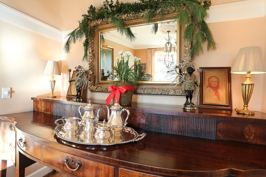 If there is anytime to get out the silver polish, it's during the holidays. This gorgeous tea set with the paper whites and holiday garland add so much to the buffet.